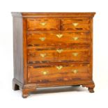 George III oak and yew wood banded chest of drawers, fitted with two short and three long drawers,
