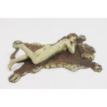 Franz Bergman cold painted bronze of a nude reclining on a tiger rug, stamped 'Namgreb', 11.5cm