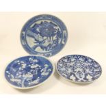 Two Japanese porcelain prunus blossom blue and white plates, 31.5cm and 34cm diameter; also a