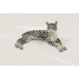Continental porcelain model of a recumbent leopard, unmarked but possibly Meissen, 19th Century,