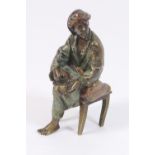 Austrian cold painted bronze of a weary traveller, seated on a stool, height 9cm