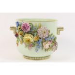 French porcelain floral encrusted jardiniere, pale celadon ground decorated with an abundance of