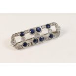 Art Deco sapphire and diamond brooch, open canted rectangular form set with eight round cut