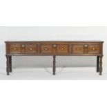 Oak low dresser, circa 1700-20, two plank top over three double moulded panel drawers with