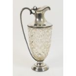 George V silver mounted cut glass claret jug, London 1912, of Etruscan urn shape, with hinged cover,