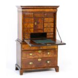 Queen Anne walnut secretaire, circa 1710, the secretaire top having an ovolu fronted long drawer
