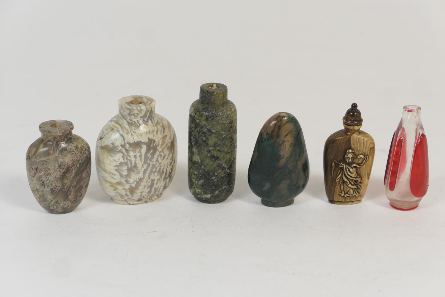 Six Chinese snuff bottles, four being in hardstone, the largest of cylinder form, 8cm; the other two