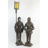 Pair of armoured knights cast iron companion stands, one supporting fire irons, 84cm, the other
