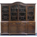 Fine Waring & Gillow Ltd mahogany breakfront library bookcase, in Chippendale Revival style, the