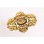 Victorian gold brooch, centred with an oval amber coloured stone, circa 1870, the stone approx. 18mm