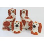 Pair of Victorian Staffordshire money boxes in the form of King Charles spaniel heads,