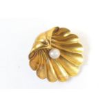 Victorian scallop shell brooch, centred with a single pearl, finished in unmarked yellow metal,