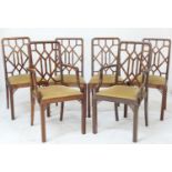 Set of six mahogany cockpen style dining chairs, early 20th Century, comprising two carvers and four