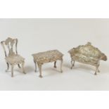 Three modern silver ornamental miniature pieces of furniture, Birmingham 1961/2 comprising a