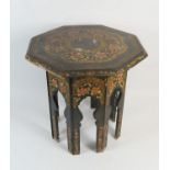 Kashmiri hand decorated octagonal topped folding table, decorated with flowers and gilt edged with