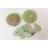 Chinese apple green jade bi-disc, simplistically carved with a lingzhi form, 5cm diameter; also a