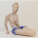 Goldscheider style pottery figure of a female nude, modelled seated on the floor and draped around