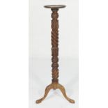 Mahogany carved torchere, 28cm diameter dished circular top on acanthus carved and wrythen moulded