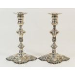 Pair of George II silver candlesticks, by James Gould, London 1744, having removable nozzles over