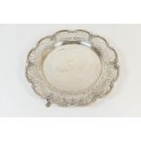 George V silver tray, Sheffield 1912, circular form with pierced C-scroll border, raised on three