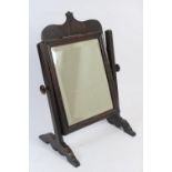 Mahogany toilet mirror, 19th Century, rectangular bevelled glass plate within a moulded border