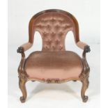 Victorian rosewood and upholstered lady's armchair, deep buttoned dusky pink fabric back and seat,