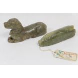 Chinese carved celadon jade figure of a recumbent dog, 9.5cm; also a carved jadeite pendant worked