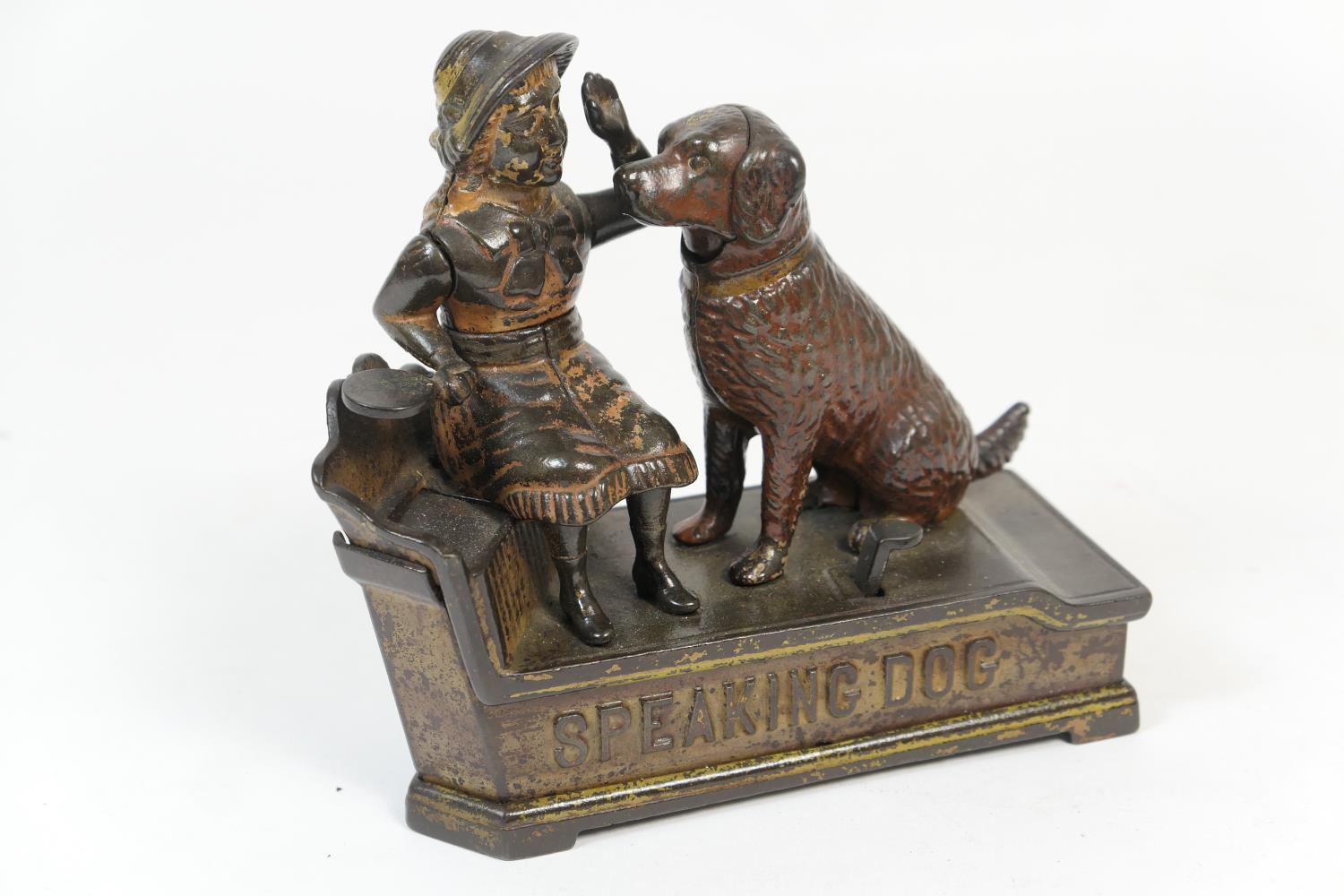 Novelty painted cast iron money box, formed as a speaking dog, from an 1885 patent, height 18cm (