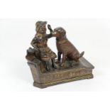 Novelty painted cast iron money box, formed as a speaking dog, from an 1885 patent, height 18cm (