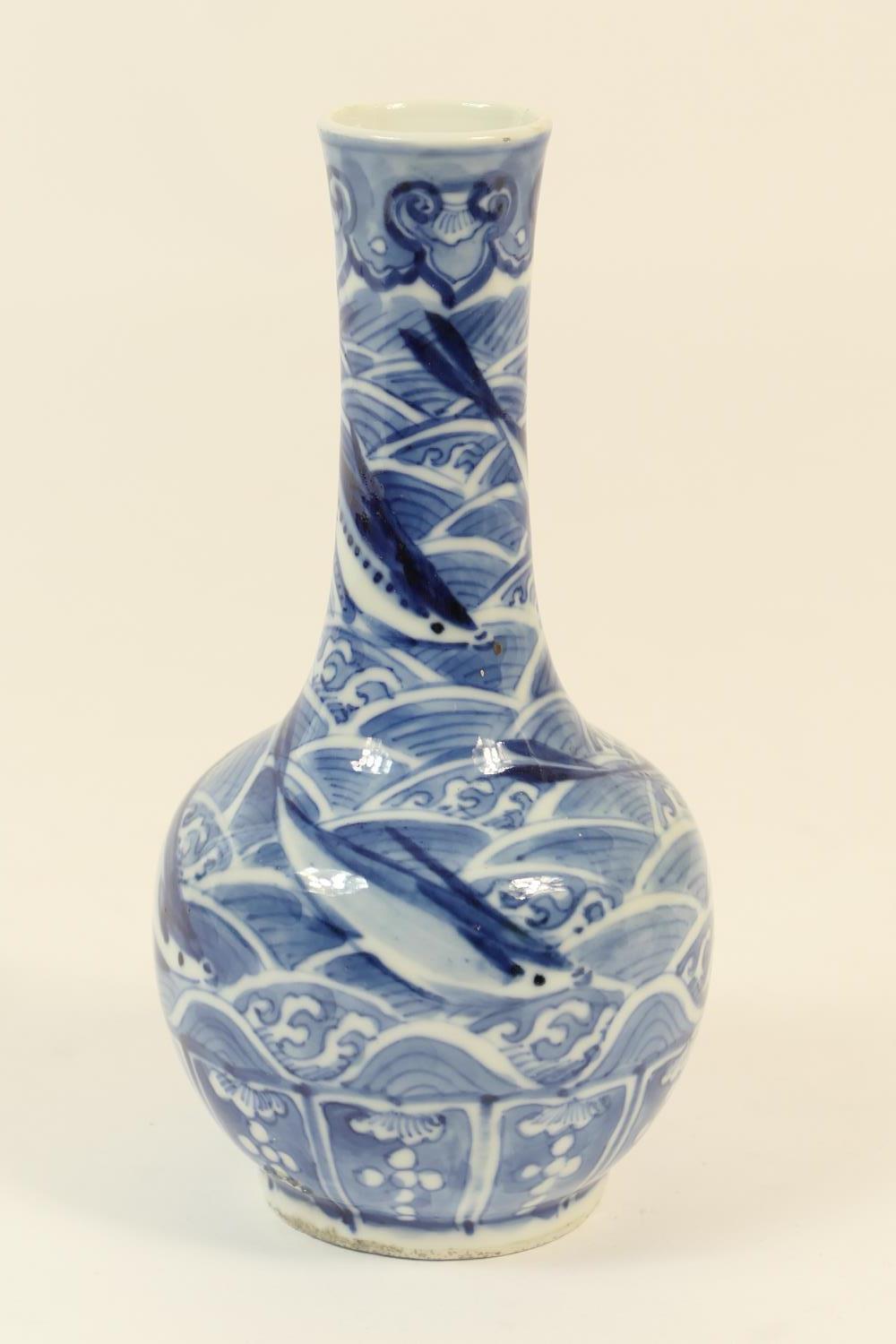 Chinese blue and white bottle vase, late 19th Century or early 20th Century, decorated with flying