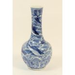 Chinese blue and white bottle vase, late 19th Century or early 20th Century, decorated with flying