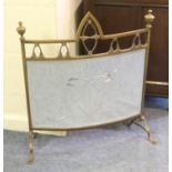 Edwardian brass and mirrored firescreen, bowed shape surmounted with finials and with cut linear