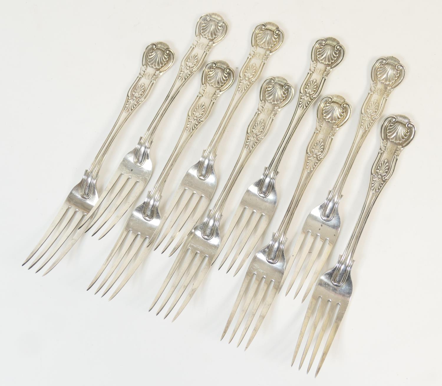 Nine Victorian silver Kings pattern table forks, by George Adams, London 1872, engraved with a