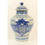 Italian blue and white covered jar, inverted baluster shape decorated with a baronial style crest
