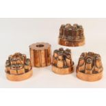 Four Victorian copper jelly moulds, by Benham & Froud, numbered 201, 369, 500 and 621, 11-12cm high;