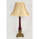 Victorian brass and ruby glass table lamp, having a brass capped octagonal ruby glass column over