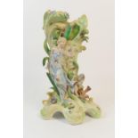 German porcelain figural vase, circa 1900, modelled as a water nymph against waves and reeds (