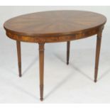 Flame mahogany and satinwood oval centre table, in Sheraton style, the oval top with reeded edge