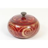 Bernard Moore flambe tobacco jar and cover, by Annie Ollier, circa 1905-15, squat bun form decorated