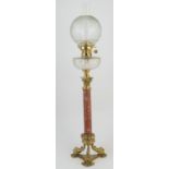 Decorative brass and cut glass oil lamp, having a globular etched glass shade, complete with