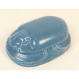 Pilkingtons Lancastrian scarab beetle paperweight, decorated in an allover matte blue glaze,
