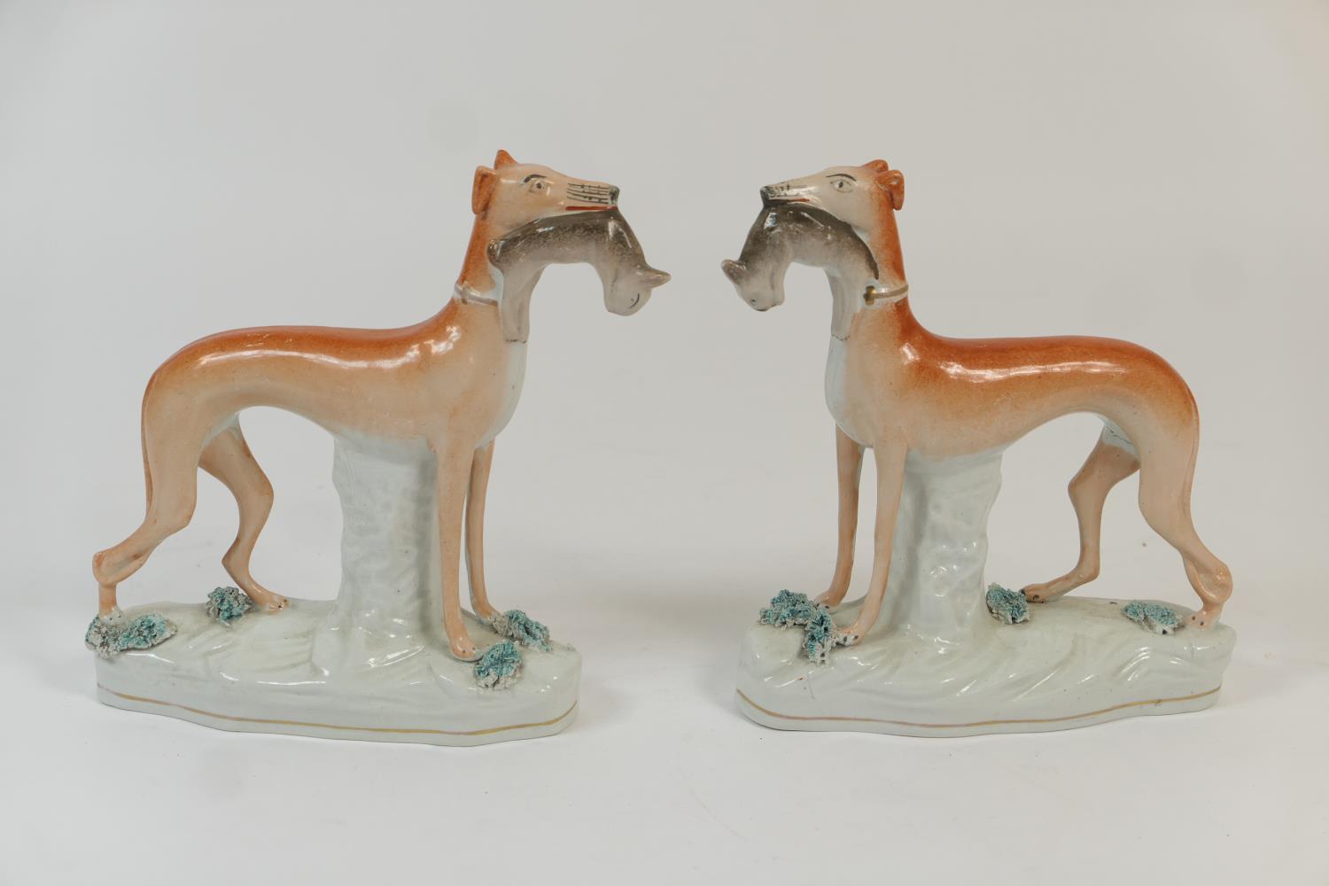 Pair of Staffordshire flatback greyhound figures, late 19th Century, decorated in naturalistic