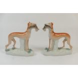 Pair of Staffordshire flatback greyhound figures, late 19th Century, decorated in naturalistic