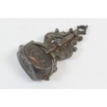 Wrought metal swivelling seal fob, late 17th or early 18th Century, having three seals fixed by a