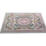 Fine quality Aubusson style woollen carpet, ivory field centred with a laurel leaf oval and pink