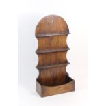 Oak boarded spoon rack in Georgian style, the shaped back with three racks and an open box