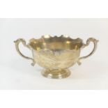 Walker & Hall silver twin handled bowl, Birmingham 1924, with a crenellated rim, raised on a stepped