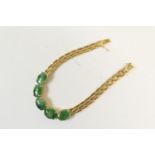 Chinese 14ct gold and jadeite bracelet, set with five cabochon oval jades on a brick link