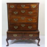 Mahogany chest on stand, the upper part late 18th Century, the stand later, fitted with three