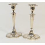 Pair of Walker & Hall silver candlesticks, Sheffield 1957, fluted oval form with removable